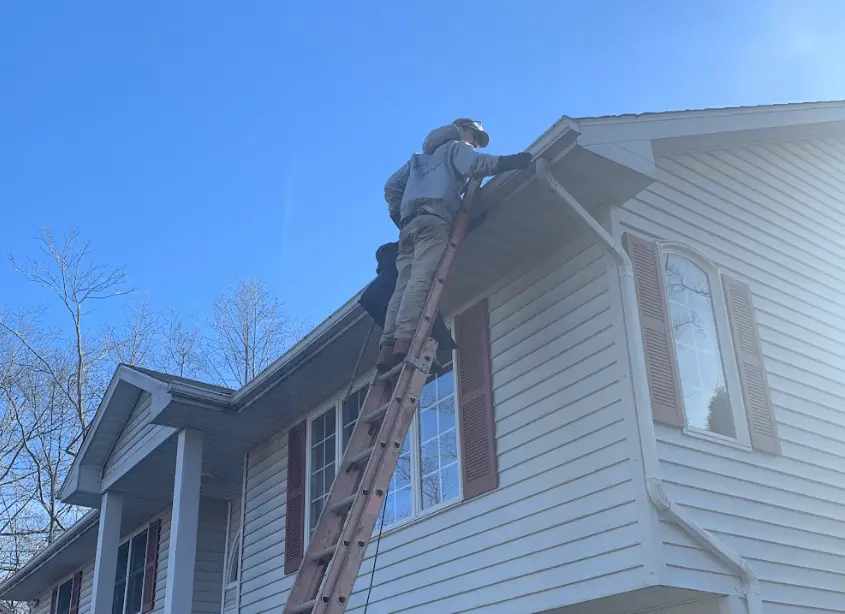 Gutter cleaning and maintenance being performed by Garfield Heights Power Washing in Garfield Heights